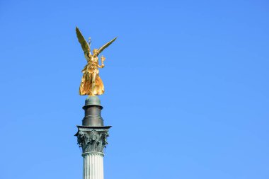 Nike Victory Goddess Sculpture as Peace Monument with Peace Angel - also Friedensengel - is landmark, monument and sightseeing spot of the Maximiliansanlagen in Munich - Bavaria, Germany, Europe