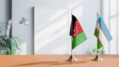 FLAGS OF AFGHANISTAN AND UZBEKISTAN ON TABLE clipart