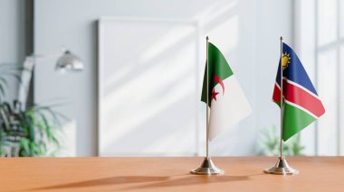 FLAGS OF ALGERIA AND NAMIBIA ON TABLE clipart