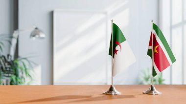 FLAGS OF ALGERIA AND SURINAME ON TABLE clipart