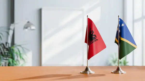 stock image FLAGS OF ALBANIA AND SOLOMON ISLANDS ON TABLE