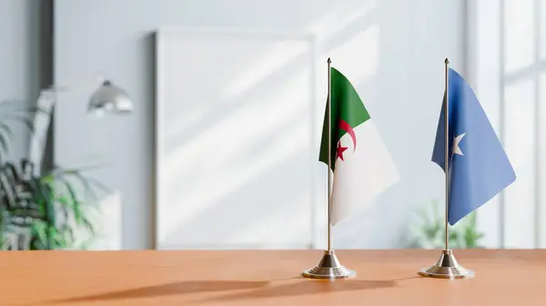 stock image FLAGS OF ALGERIA AND SOMALIA ON TABLE