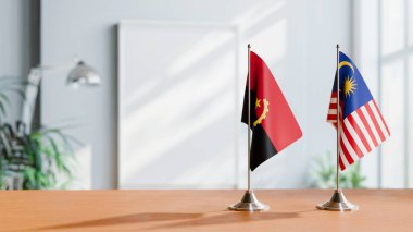 FLAGS OF  ANGOLA AND MALAYSIA  ON TABLE clipart