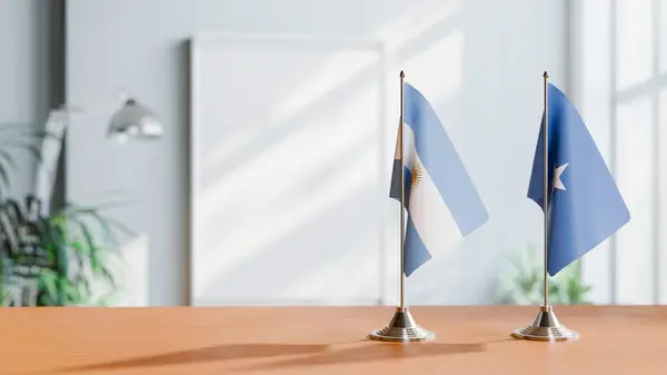 stock image FLAGS OF  ARGENTINA AND SOMALIA  ON TABLE