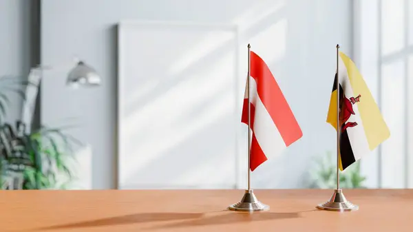 stock image FLAGS OF  AUSTRIA AND BRUNEI  ON TABLE