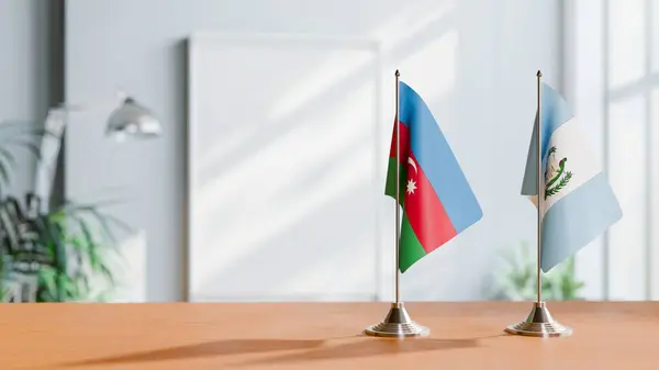 stock image FLAGS OF  AZERBAIJAN AND GUATEMALA  ON TABLE