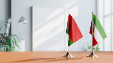 FLAGS OF  BELARUS AND EQUATORIAL GUINEA  ON TABLE clipart