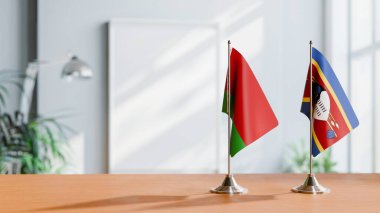 FLAGS OF  BELARUS AND ESWATINI  ON TABLE clipart