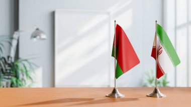 FLAGS OF  BELARUS AND IRAN  ON TABLE clipart