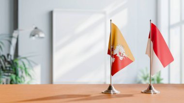 Masanın üzerinde BHUTAN ve Monako 'nun bayrakları