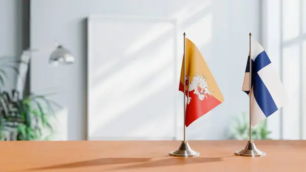 stock image FLAGS OF BHUTAN AND FINLAND ON TABLE