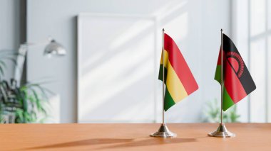 Masanın üzerinde Bolivya ve Malavi bayrağı