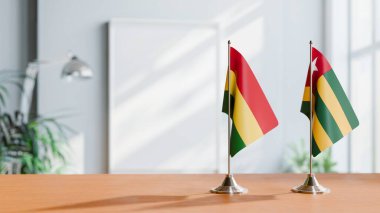 FLAGS OF BOLIVIA AND TOGO ON TABLE clipart