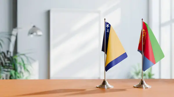 stock image FLAGS OF BOSNIA AND ERITREA ON TABLE