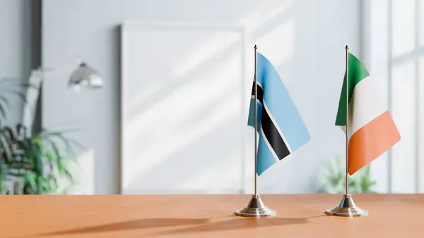 stock image FLAGS OF BOTSWANA AND IRELAND ON TABLE