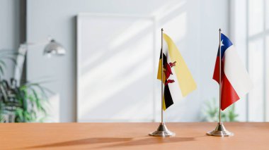 FLAGS OF BRUNEI AND CHILE ON TABLE clipart