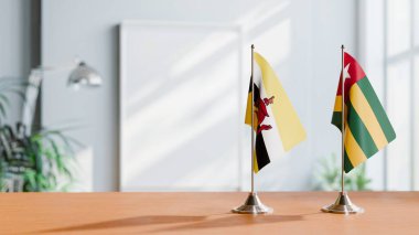 FLAGS OF BRUNEI AND TOGO ON TABLE clipart