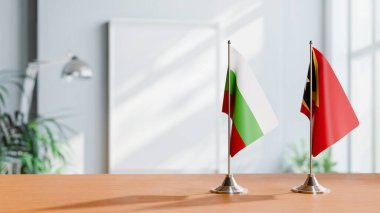 FLAGS OF BULGARIA AND EAST TIMOR ON TABLE