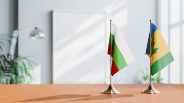 FLAGS OF BULGARIA AND SAINT VINCENT ON TABLE clipart