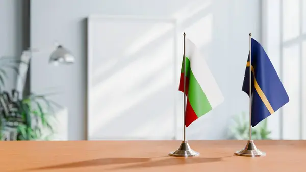 stock image FLAGS OF BULGARIA AND NAURU ON TABLE