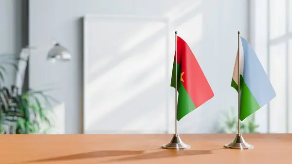 stock image FLAGS OF BURKINA-FASO AND DJIBOUTI ON TABLE