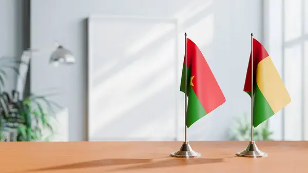 stock image FLAGS OF BURKINA-FASO AND GUINEA-BISSAU ON TABLE