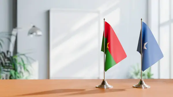 stock image FLAGS OF BURKINA-FASO AND SOMALIA ON TABLE