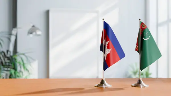 stock image FLAGS OF CAMBODIA AND TURKMENISTAN ON TABLE