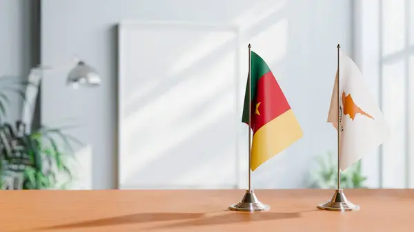 stock image FLAGS OF CAMEROON AND CYPRUS ON TABLE