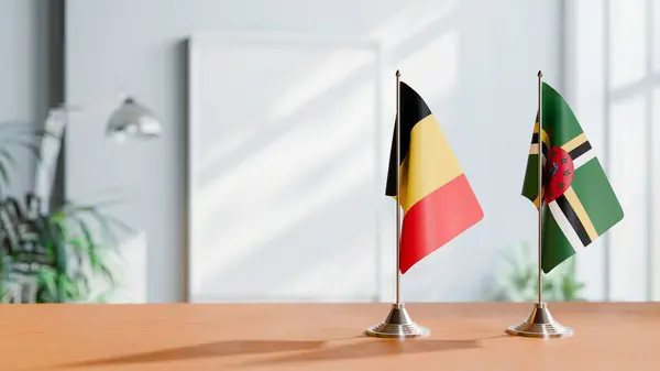 stock image FLAGS OF CHAD AND DOMINICA ON TABLE