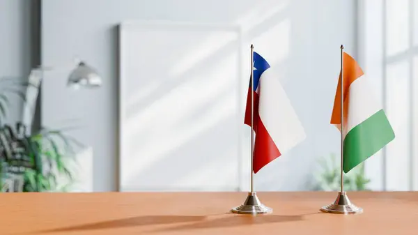 stock image FLAGS OF CHILE AND IVORY COAST ON TABLE