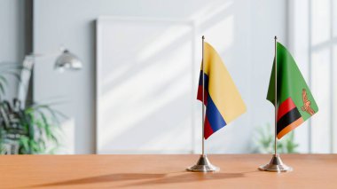 FLAGS OF COLOMBIA AND ZAMBIA ON TABLE