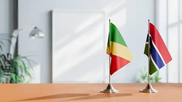 stock image FLAGS OF CONGO R AND GAMBIA ON TABLE