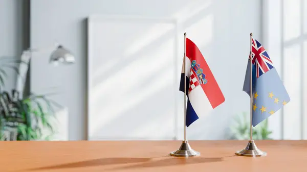 Stock image FLAGS OF CROATIA AND TUVALU ON TABLE