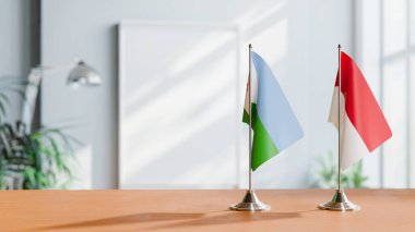 Masanın üzerinde DJIBOUTI ve Monako 'nun bayrağı