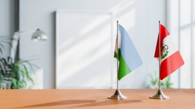 Masanın üzerinde DJIBOUTI ve Peru 'nun bayrakları
