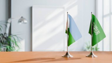 FLAGS OF DJIBOUTI AND SAUDI ARABIA ON TABLE clipart