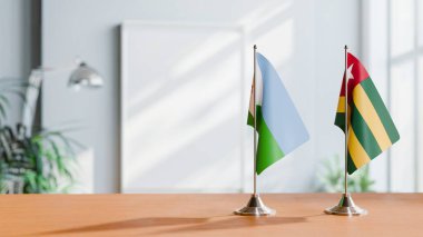 FLAGS OF DJIBOUTI AND TOGO ON TABLE clipart