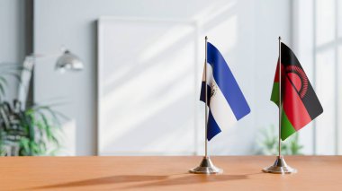 El Salvador ve Malavi 'nin bayrağı masanın üstünde.