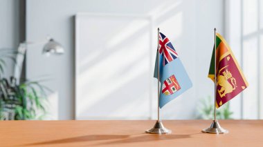 Masanın üzerinde FIJI ve SRI LANKA 'nın bayrakları