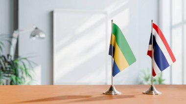 Tablonun üzerinde Gabon ve Tayland bayrağı