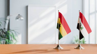 FLAGS OF GHANA AND IRAQ ON TABLE clipart