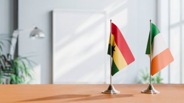 FLAGS OF GHANA AND IRELAND ON TABLE clipart