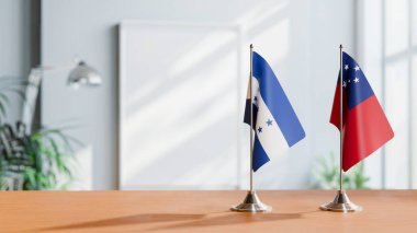 FLAGS OF HONDURAS And SAMOA ON TABLE clipart