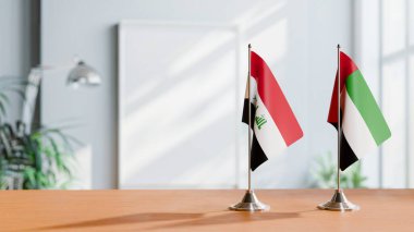 FLAGS OF IRAQ AND UAE ON TABLE clipart