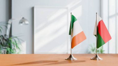 FLAGS OF IRELAND AND MADAGASCAR ON TABLE clipart