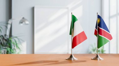 FLAGS OF ITALY AND NAMIBIA ON TABLE clipart