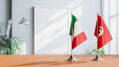 FLAGS OF ITALY AND TUNISIA ON TABLE clipart