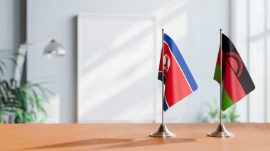 Masanın üzerinde Kore 'nin Kuzey ve Malavi Bayrakları