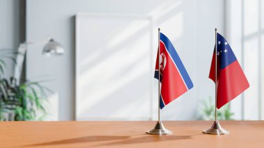 Masanın üzerinde Kore 'nin Kuzeyi ve Samoa' nın bayrağı